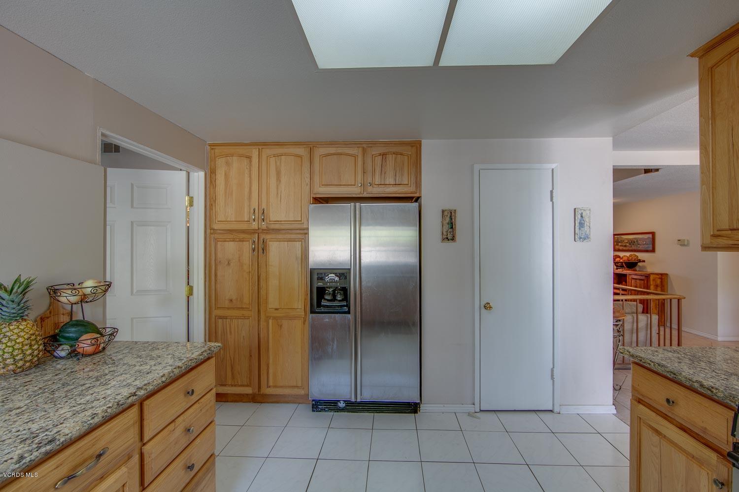 4295 Springfield Street Simi Valley, CA 93063 - Photo 11 of 40 a kitchen with stainless steel appliances granite countertop a refrigerator and a sink