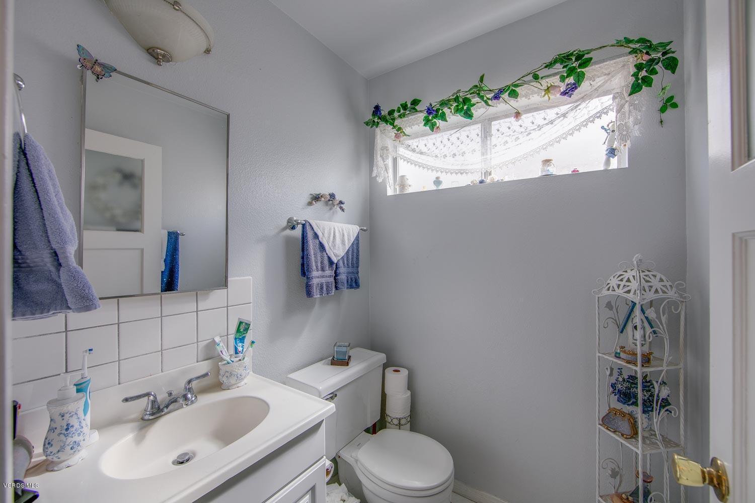 4295 Springfield Street Simi Valley, CA 93063 - Photo 16 of 40 a bathroom with a toilet sink and mirror