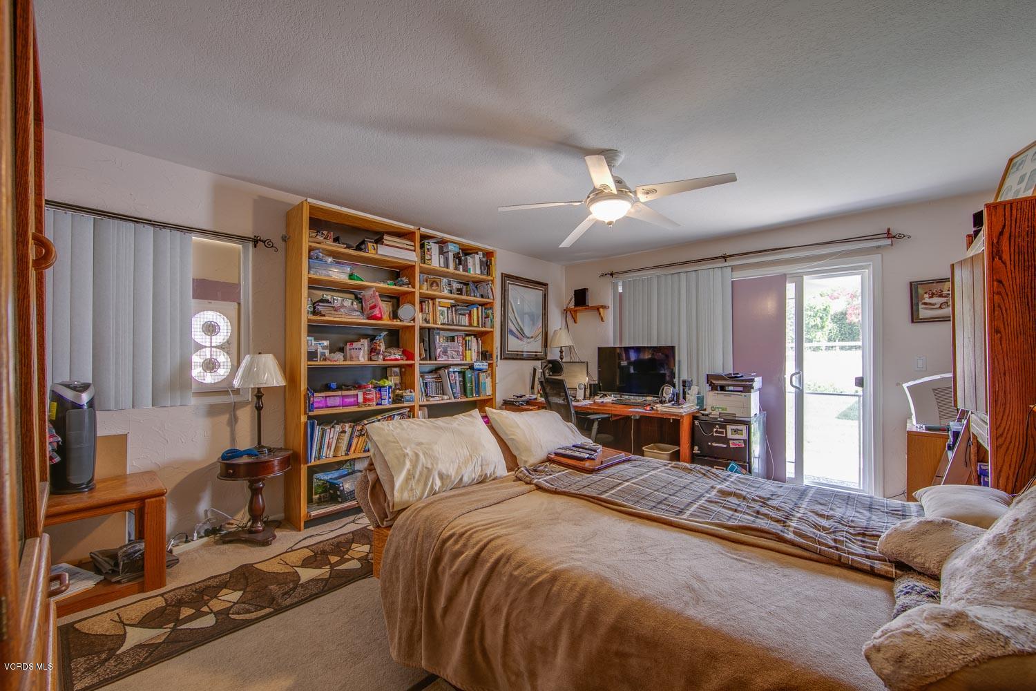 4295 Springfield Street Simi Valley, CA 93063 - Photo 23 of 40 a bedroom with a bed furniture and a flat screen tv