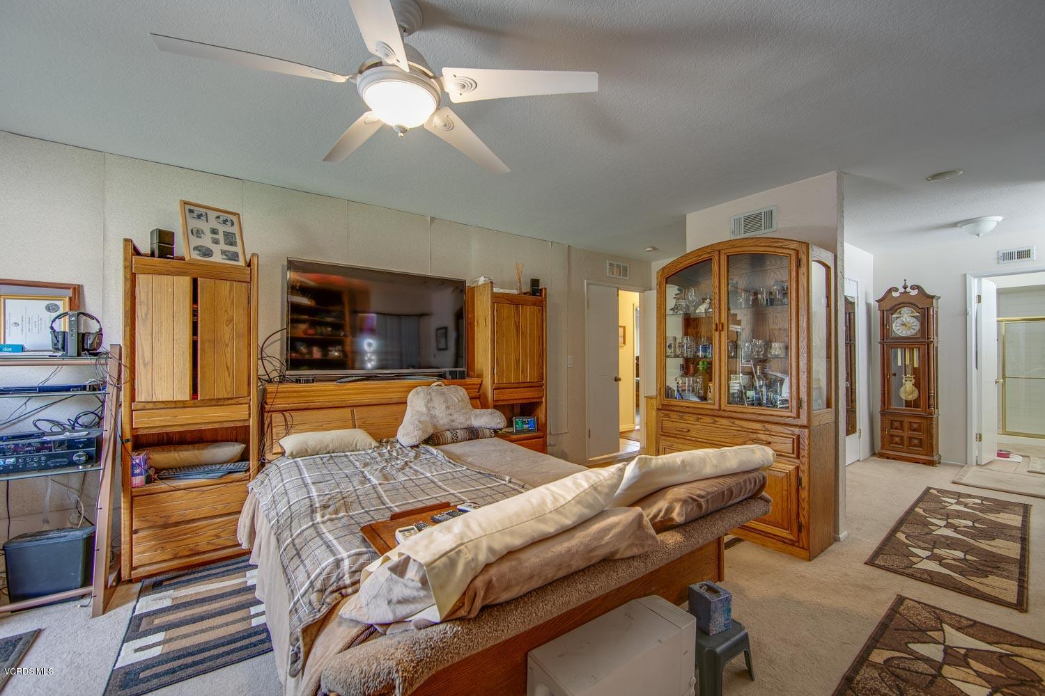 4295 Springfield Street Simi Valley, CA 93063 - Photo 25 of 40 a bedroom with a bed and wooden floor