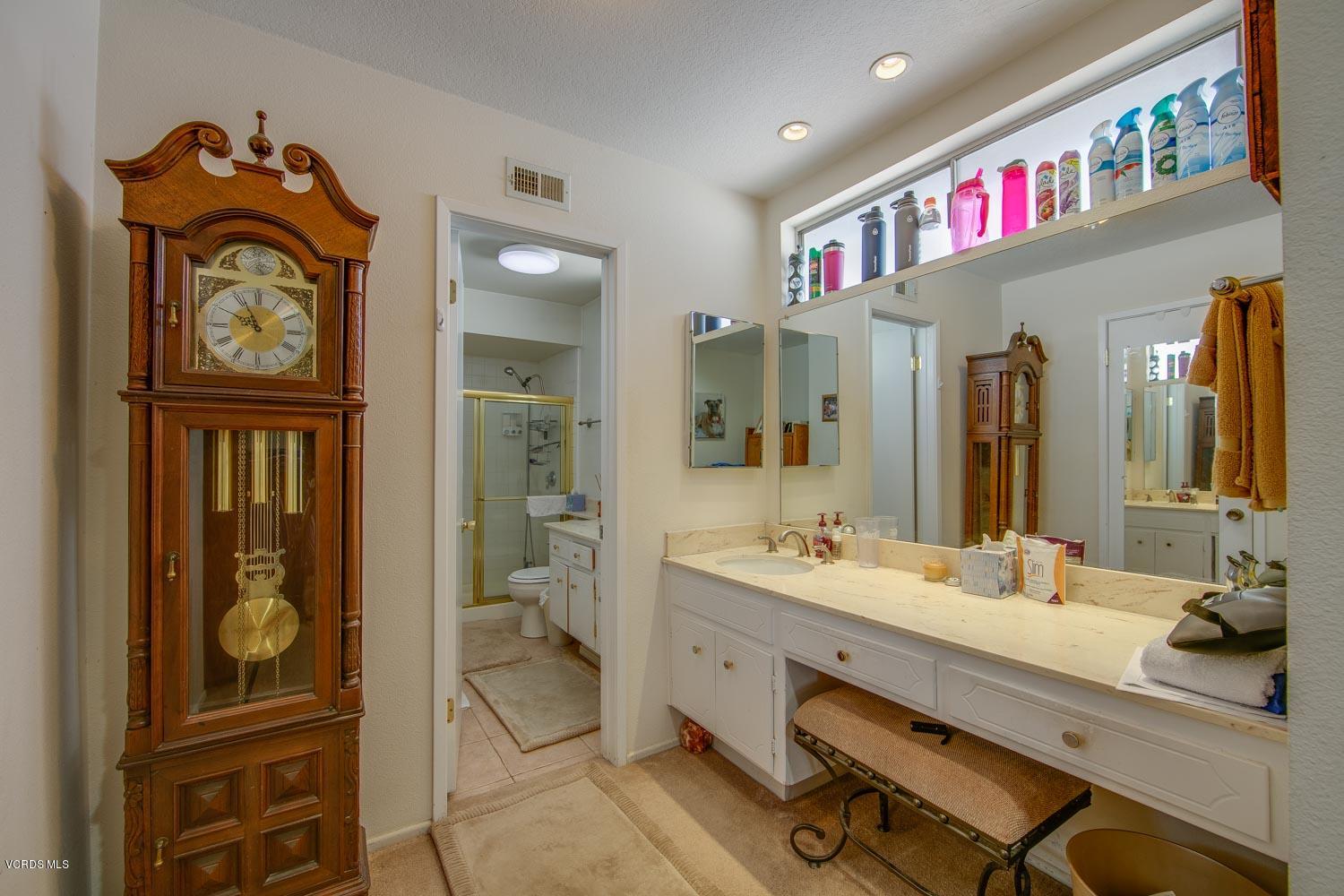 4295 Springfield Street Simi Valley, CA 93063 - Photo 27 of 40 a bathroom with a sink mirror and vanity