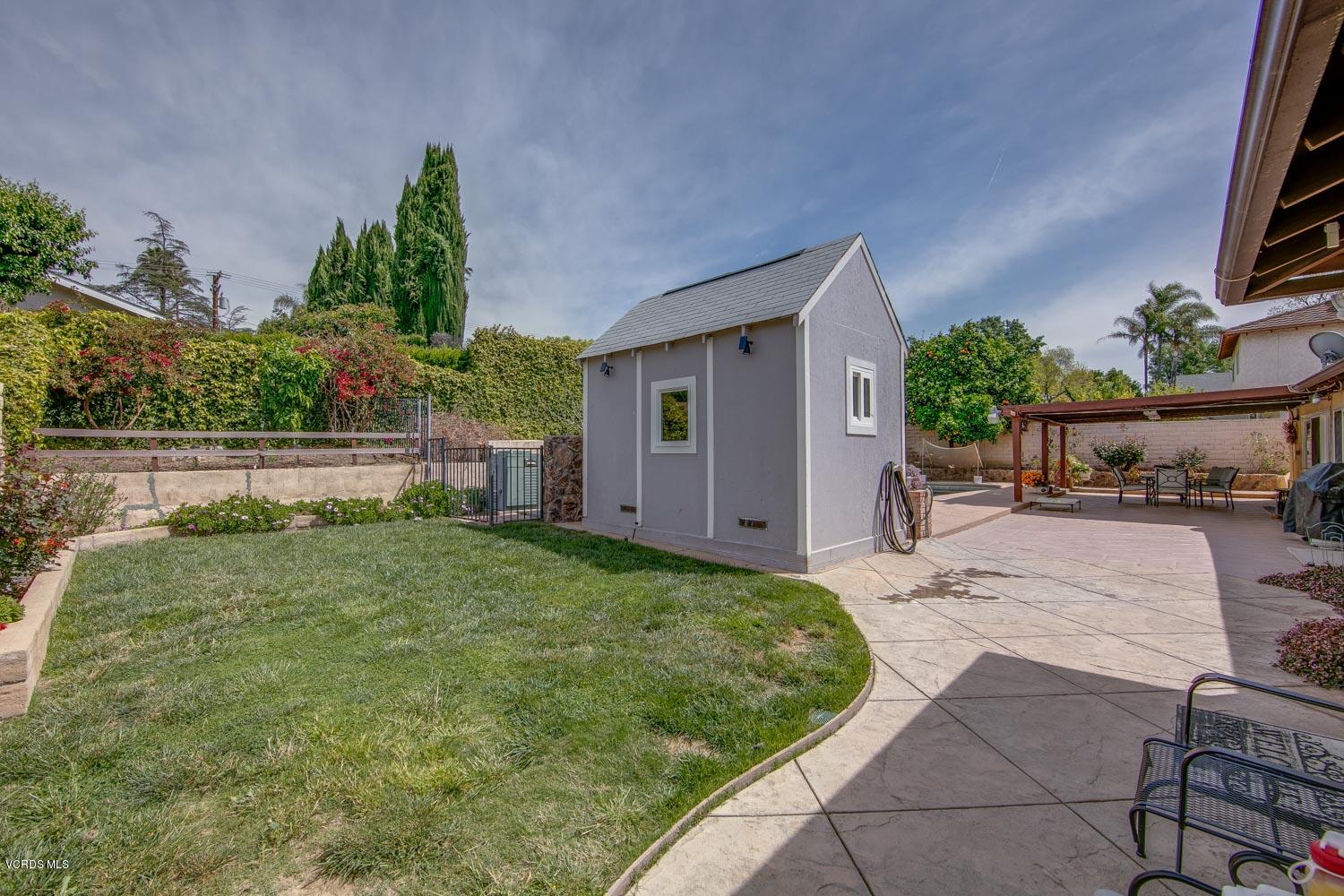 4295 Springfield Street Simi Valley, CA 93063 - Photo 30 of 40 a view of house with backyard and a garden