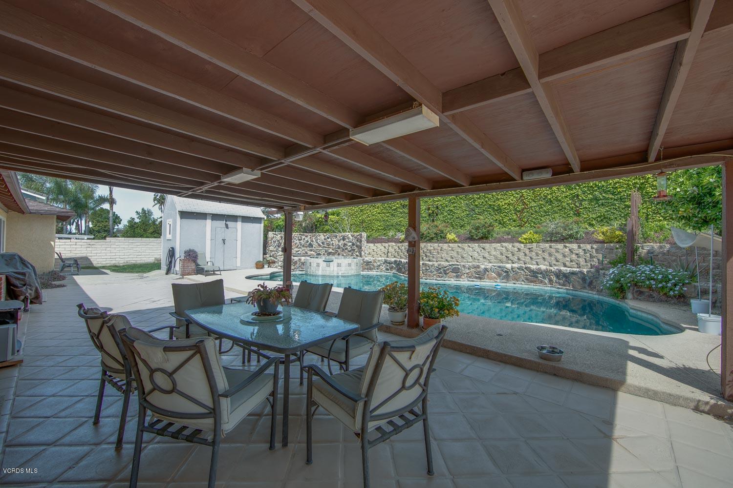 4295 Springfield Street Simi Valley, CA 93063 - Photo 34 of 40 a view of patio with table and chairs and backyard