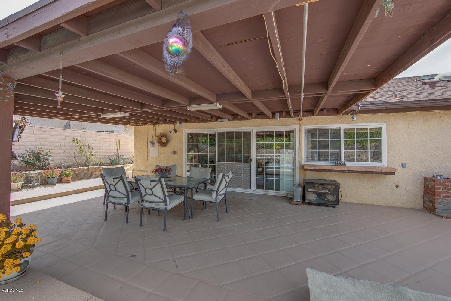 4295 Springfield Street Simi Valley, CA 93063 - Photo 35 of 40 a view of a patio with table and chairs