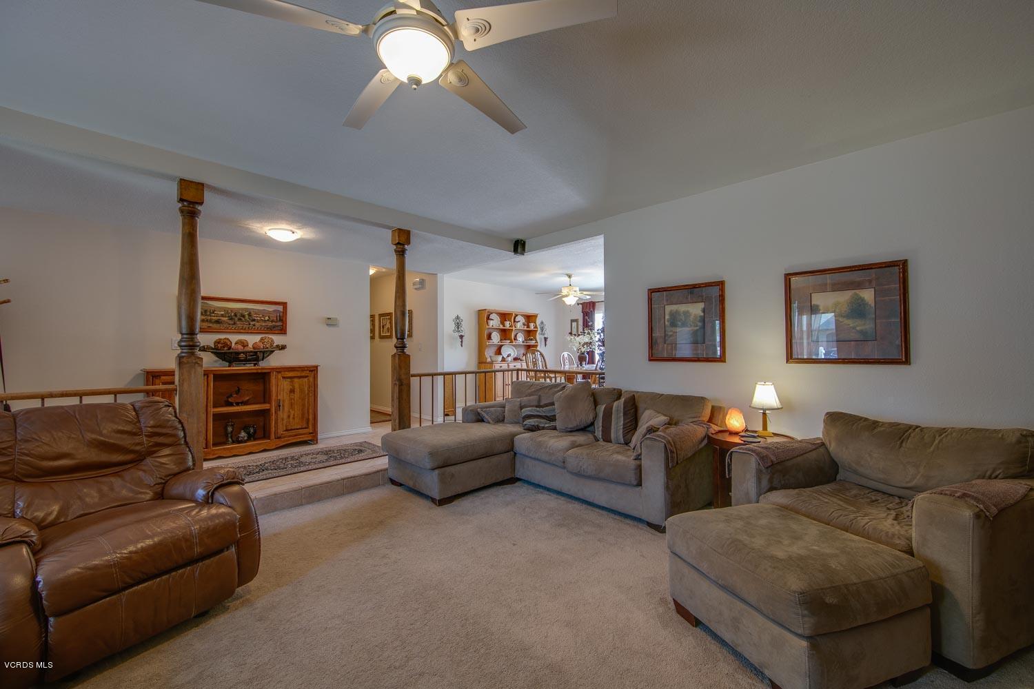 4295 Springfield Street Simi Valley, CA 93063 - Photo 6 of 40 a living room with furniture and a flat screen tv