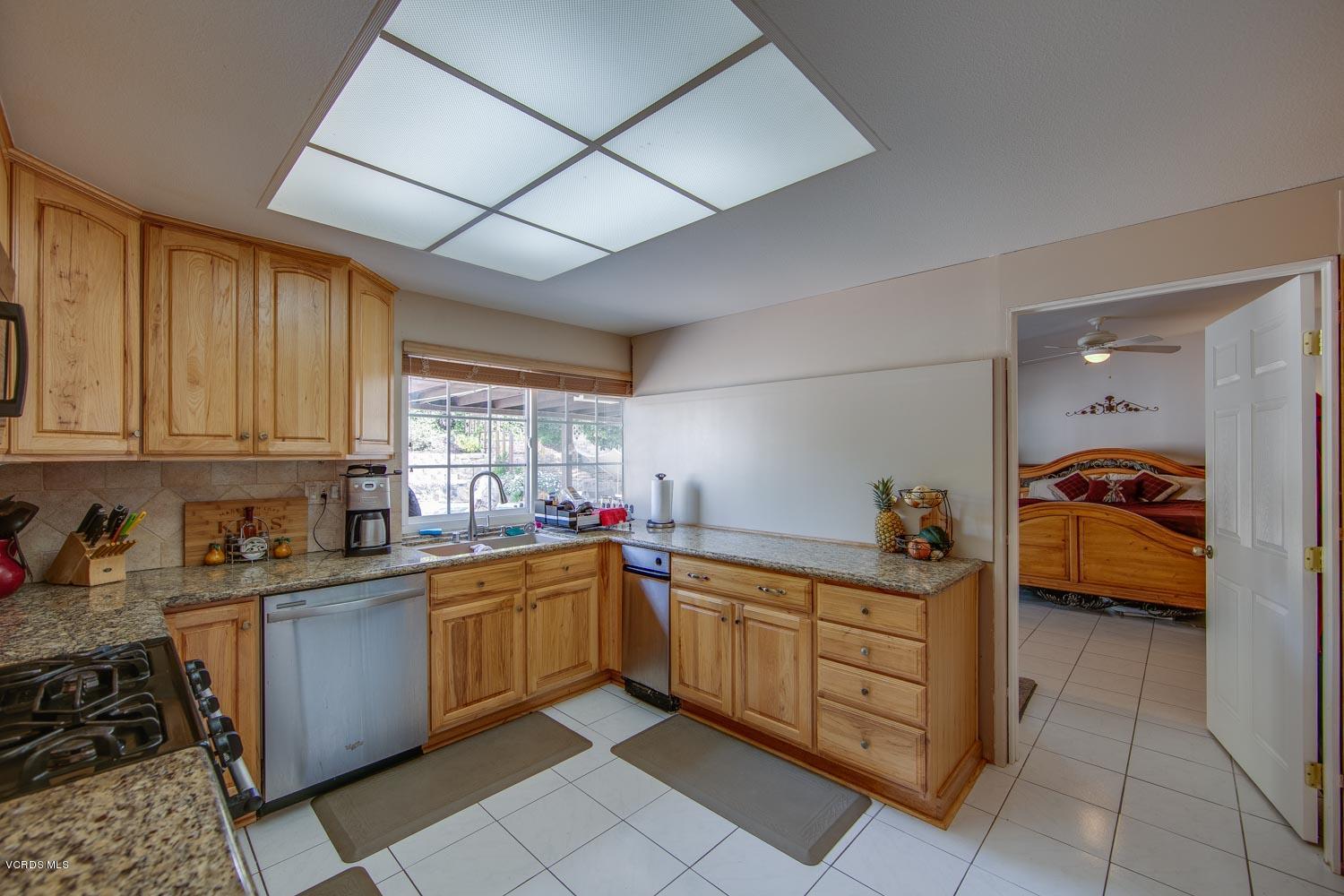 4295 Springfield Street Simi Valley, CA 93063 - Photo 9 of 40 a kitchen with a sink a stove and cabinets