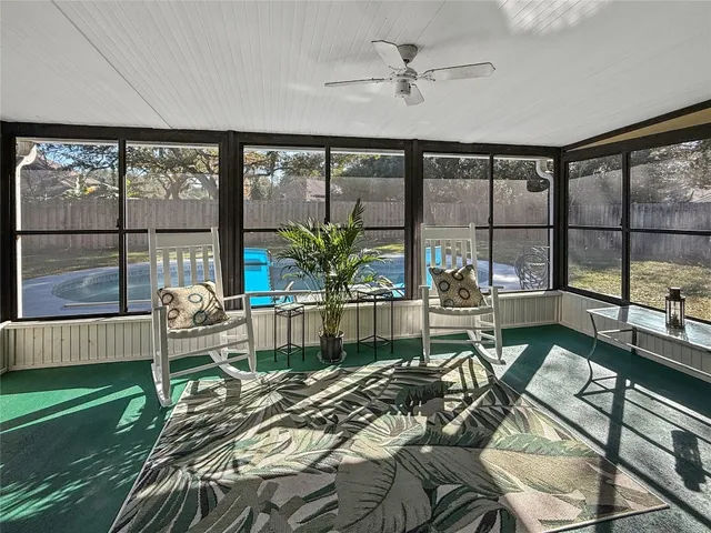 a living room with large windows