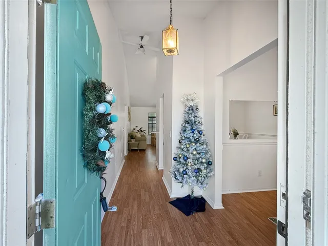 a view of entryway with wooden floor