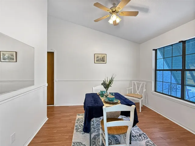 a view of a livingroom with furniture and wooden floor