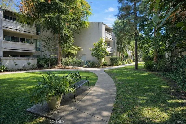 a view of a garden with a building