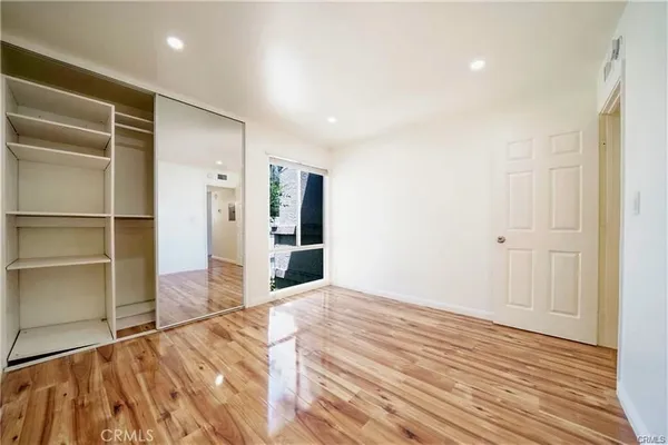 a view of a livingroom with wooden floor