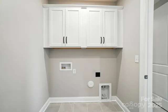 a bathroom with a double vanity sink toilet mirror and shower