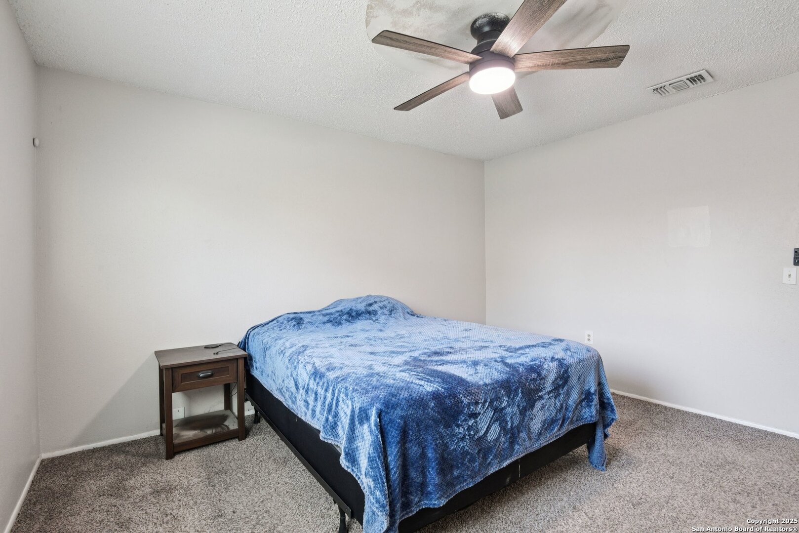 113 Friendswood Path Universal City, TX 78148 - Photo 22 of 40 a bedroom with a bed and a ceiling fan