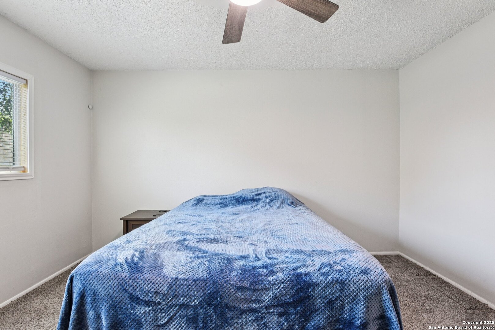 113 Friendswood Path Universal City, TX 78148 - Photo 25 of 40 a bedroom with a bed