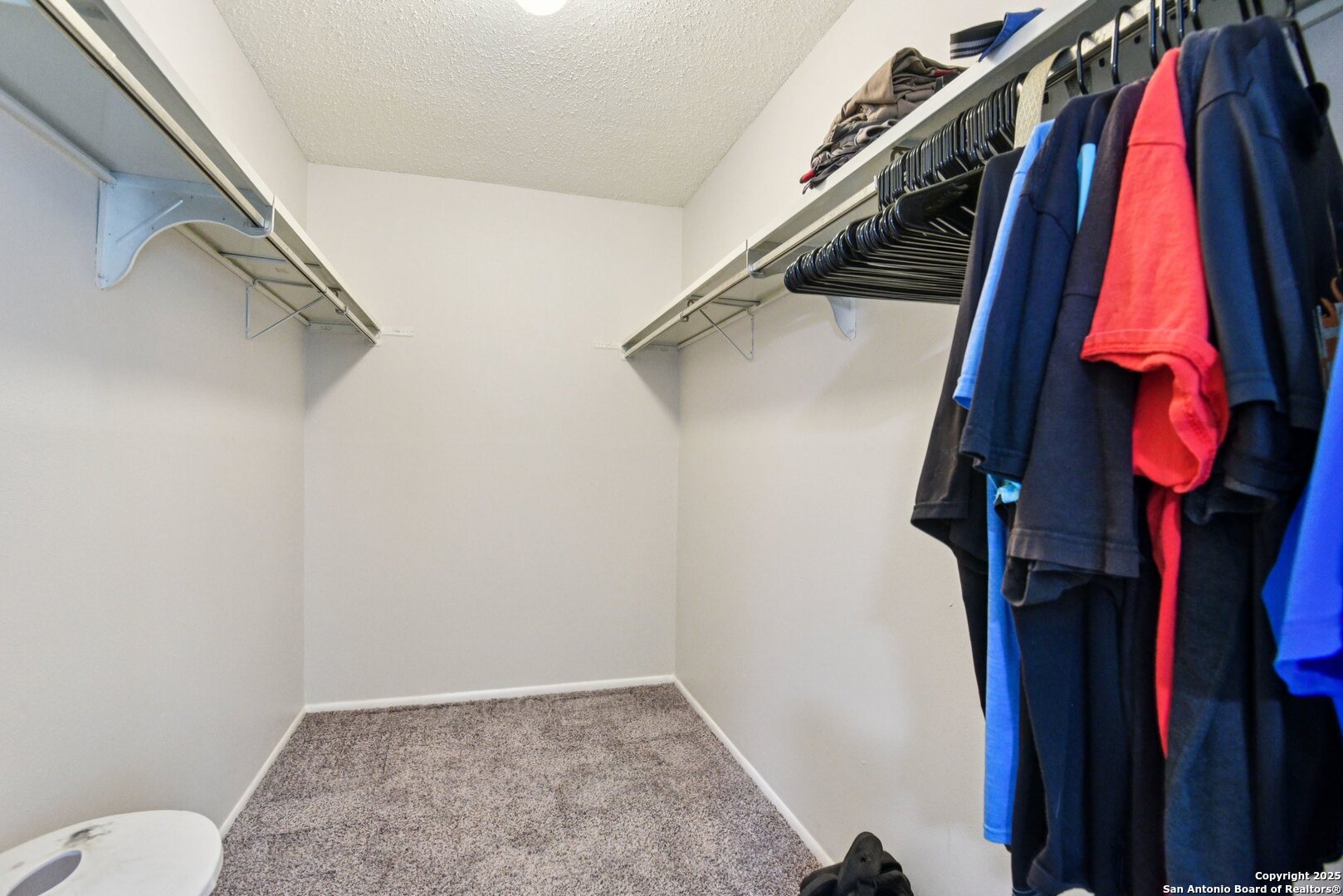 113 Friendswood Path Universal City, TX 78148 - Photo 26 of 40 a view of walk in closet with clothes and shoes