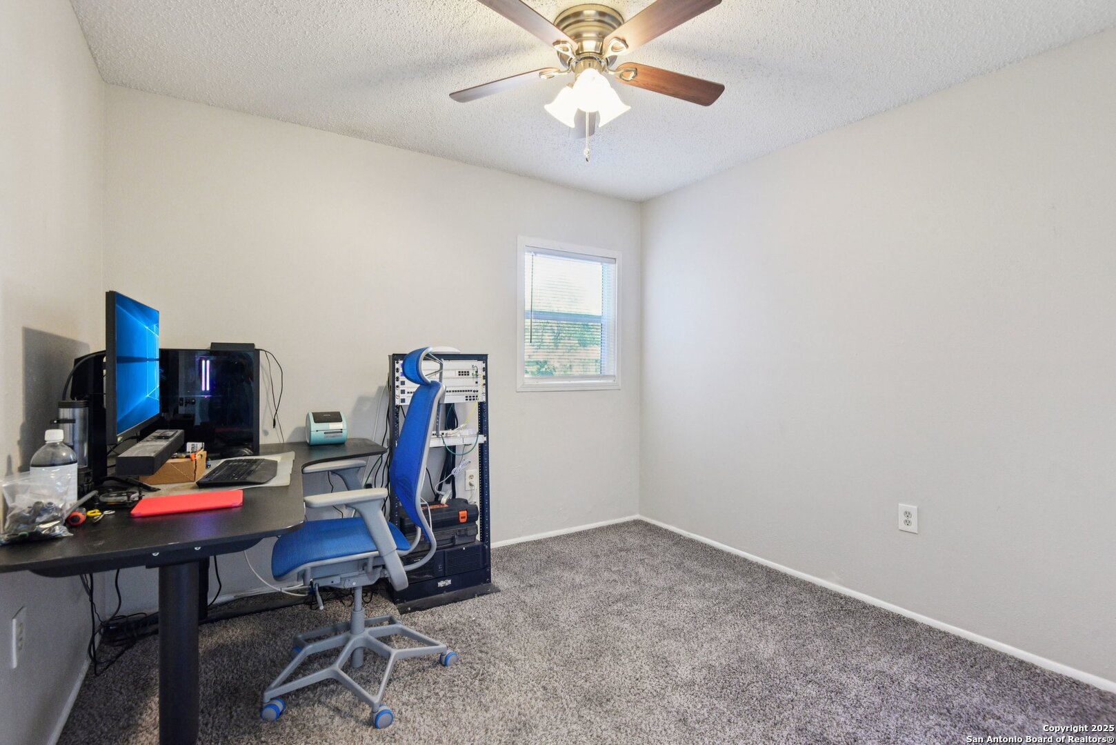 113 Friendswood Path Universal City, TX 78148 - Photo 32 of 40 a view of a workspace with furniture and a window