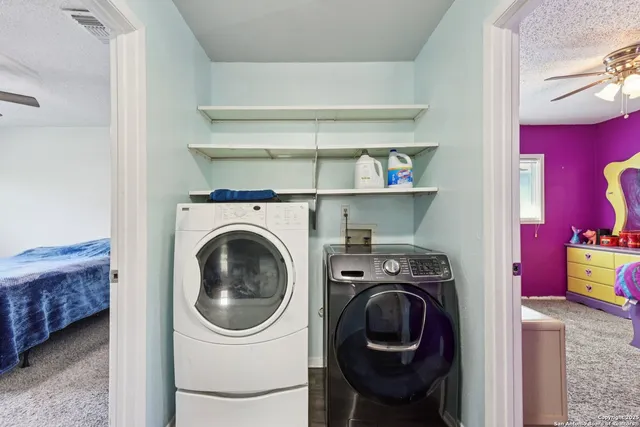 a bathroom with a granite countertop sink a toilet and a bathtub