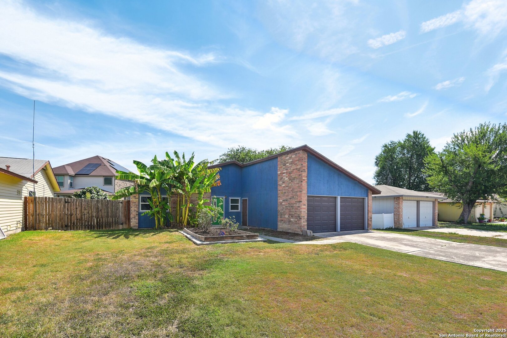 113 Friendswood Path Universal City, TX 78148 - Photo 4 of 40 a front view of house with yard and trees in the background
