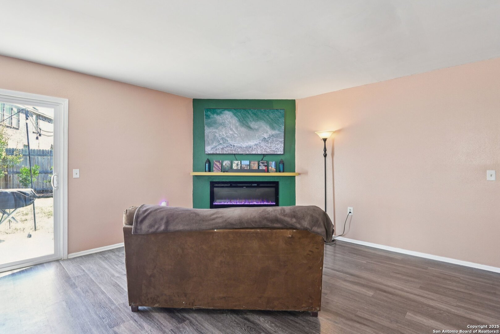 113 Friendswood Path Universal City, TX 78148 - Photo 6 of 40 a living room with furniture and a floor to ceiling window