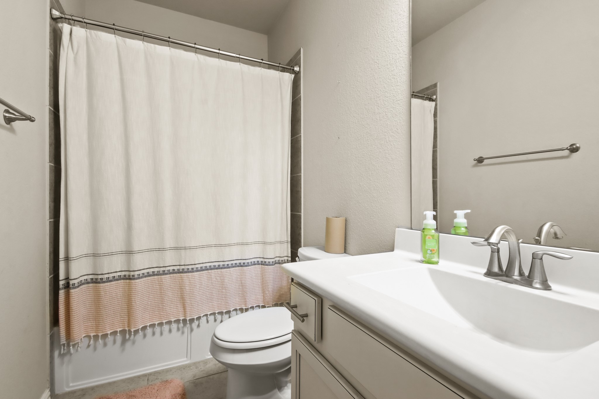 23122 Biddle Drive Porter, TX 77365 - Photo 16 of 26 Upstairs bedrooms connected by a convenient Jack and Jill bathroom, offering privacy and shared accessibility. Each bedroom provides ample space, natural light, and cozy comfort