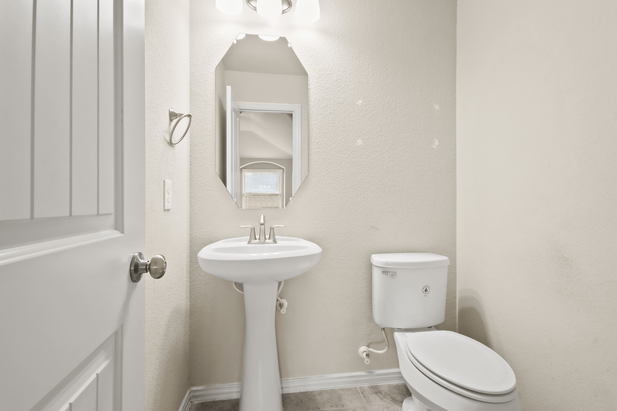 23122 Biddle Drive Porter, TX 77365 - Photo 8 of 26 Conveniently located half bath on the main level.