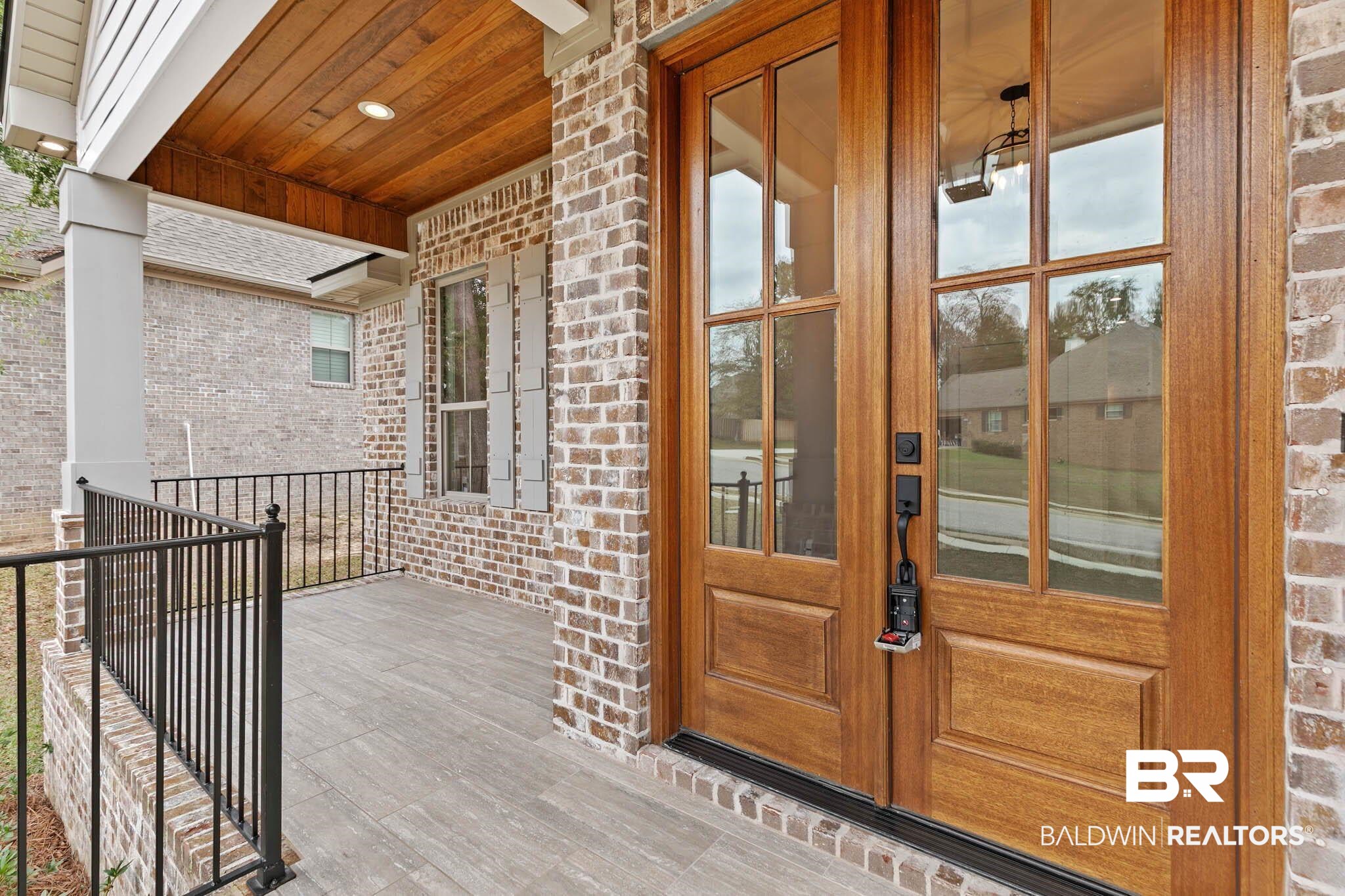 6656 Garrison Drive Daphne, AL 36527 - Photo 7 of 57 Doorway to property featuring brick siding