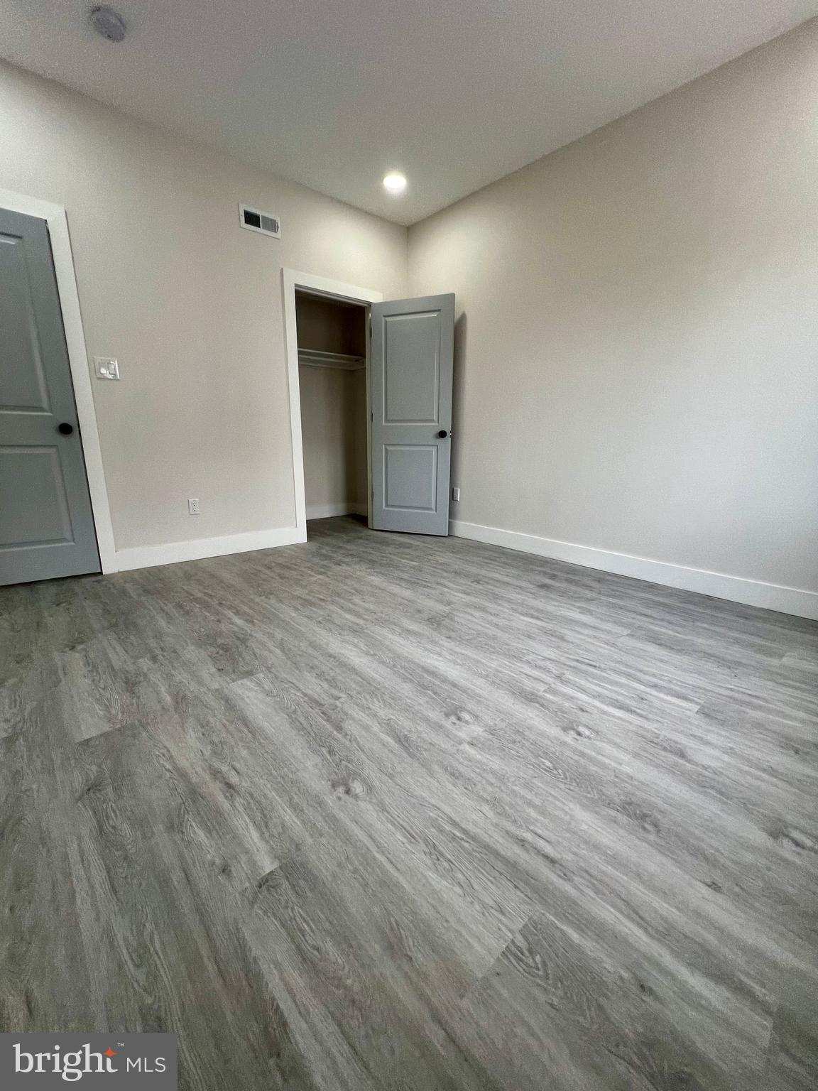 32 South 62nd Street, Unit 2 Philadelphia, PA 19139 - Photo 15 of 15 a view of an empty room with wooden floor and closet