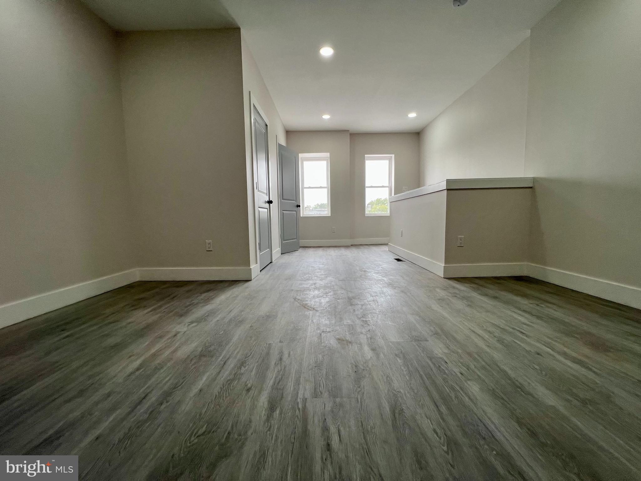 32 South 62nd Street, Unit 2 Philadelphia, PA 19139 - Photo 3 of 15 a view of empty room with wooden floor