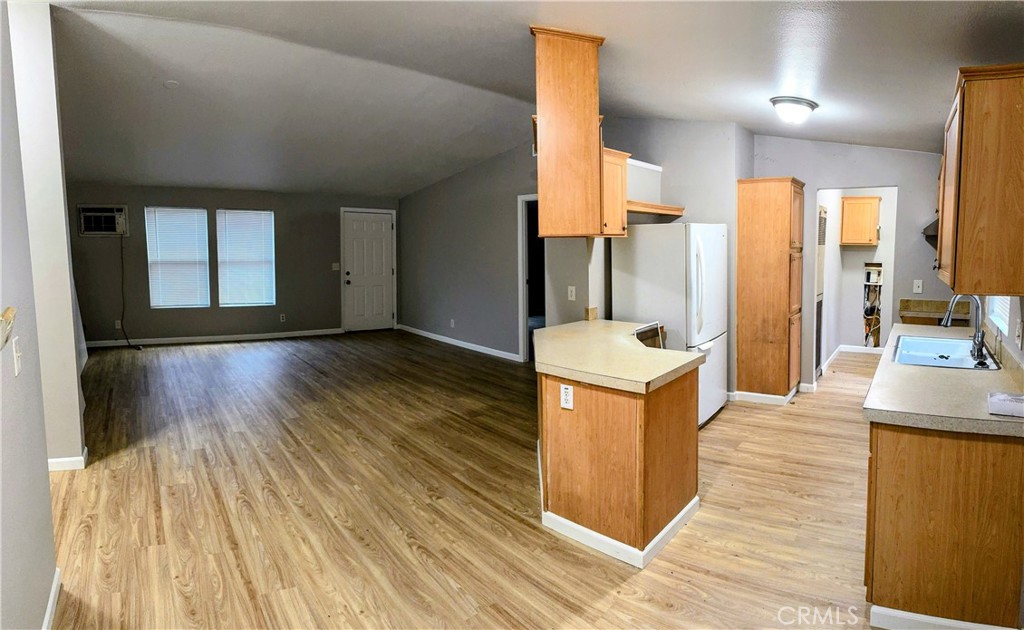 3181 Springe Street Nice, CA 95464 - Photo 11 of 14 a kitchen with a sink and a stove top oven