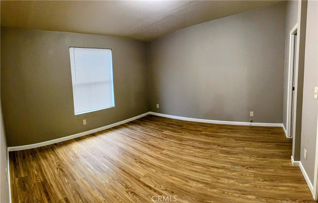 3181 Springe Street Nice, CA 95464 - Photo 12 of 14 a view of empty room with wooden floor and fan