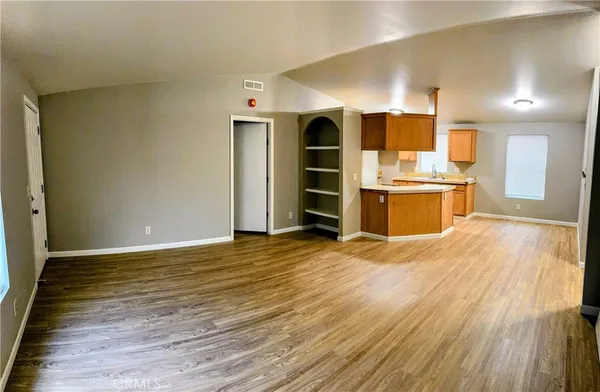 a view of a kitchen with a sink and a stove top oven