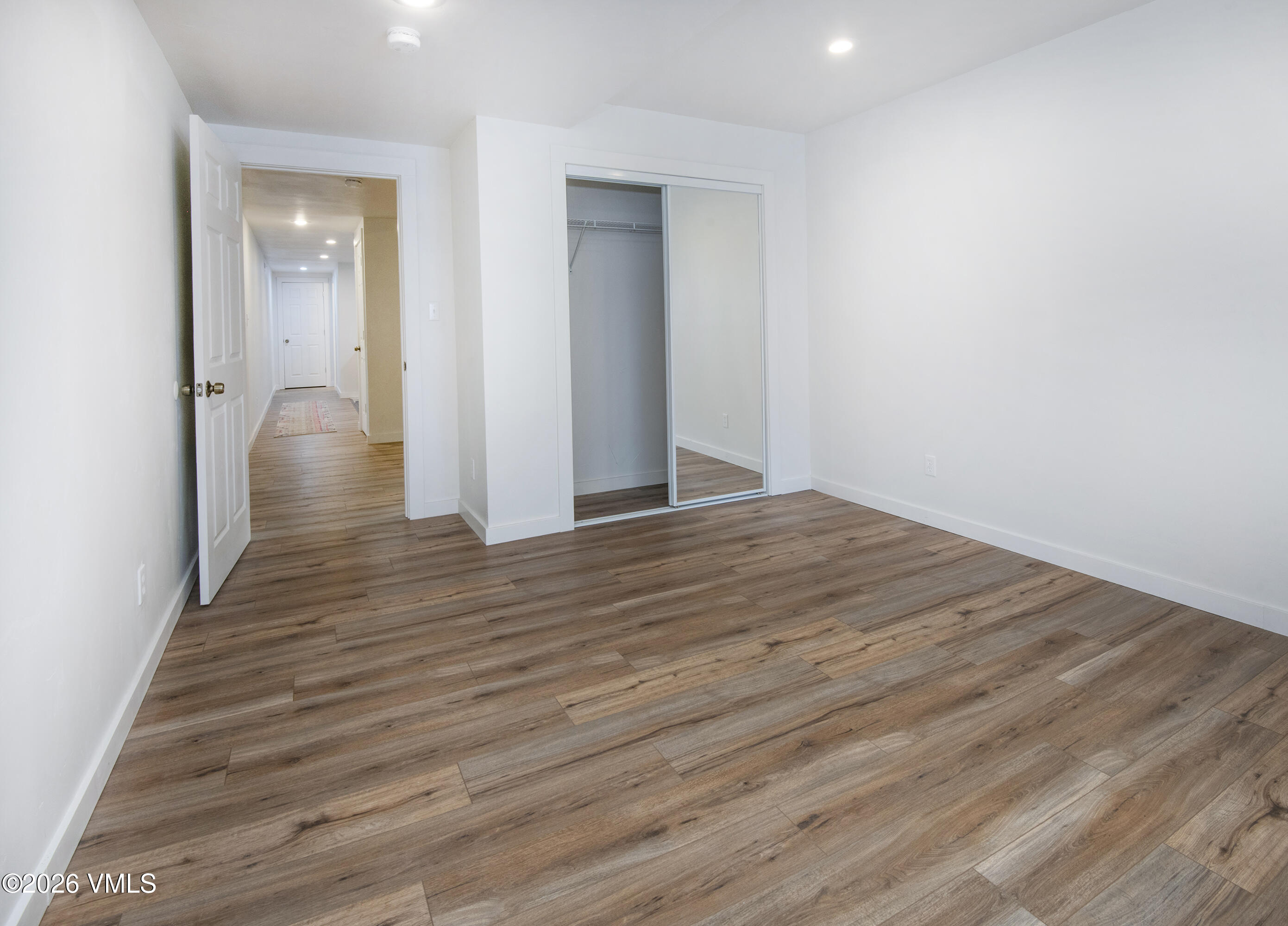 430 Porphyry Road Gypsum, CO 81637 - Photo 18 of 42 wooden floor in an empty room with wooden floor