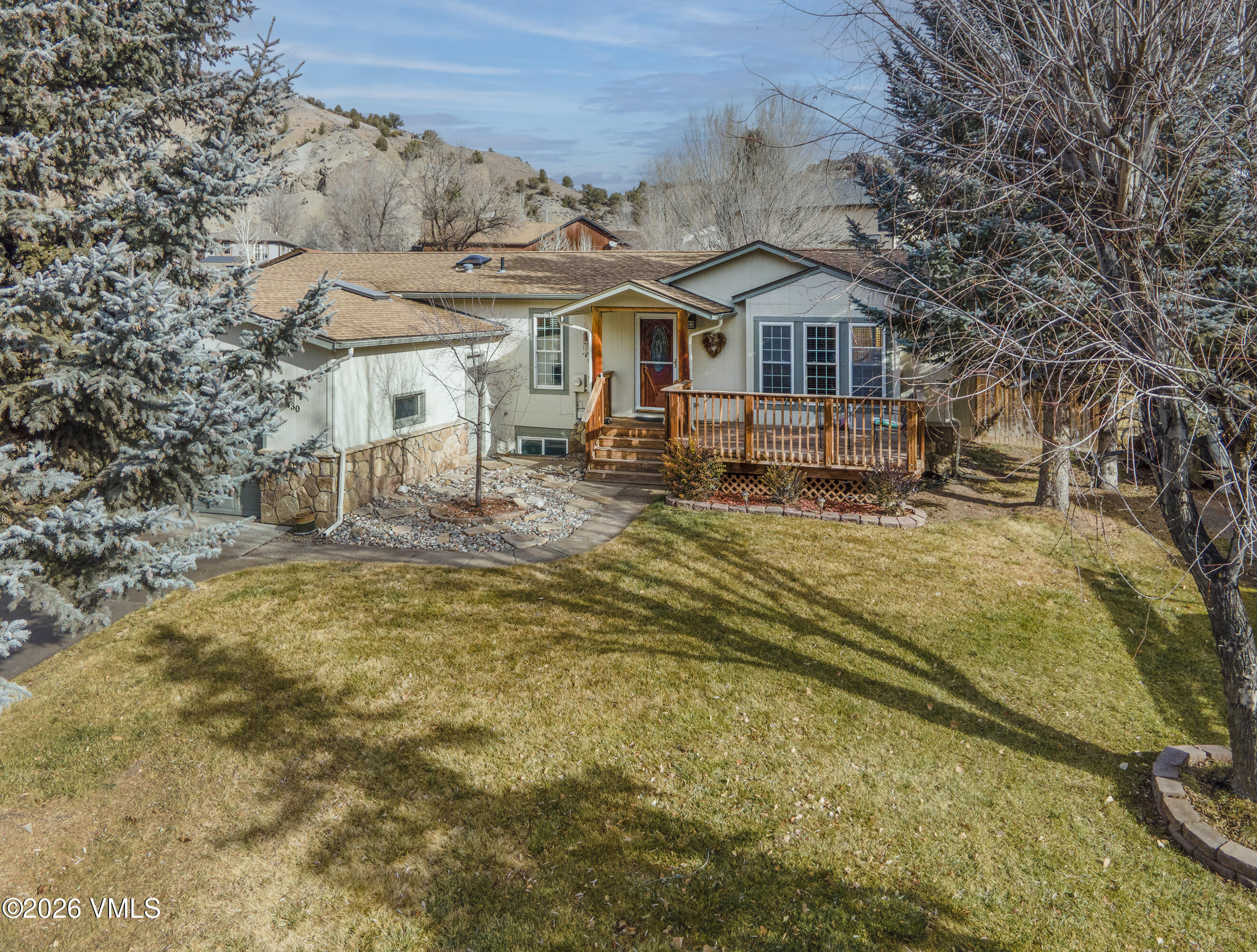 430 Porphyry Road Gypsum, CO 81637 - Photo 25 of 42 a house with trees in the background