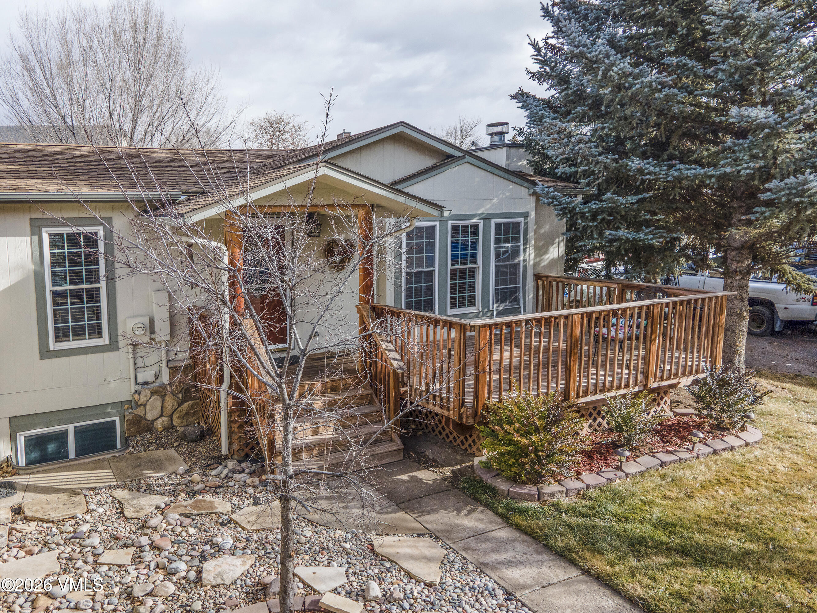 430 Porphyry Road Gypsum, CO 81637 - Photo 28 of 42 a view of a house with wooden fence