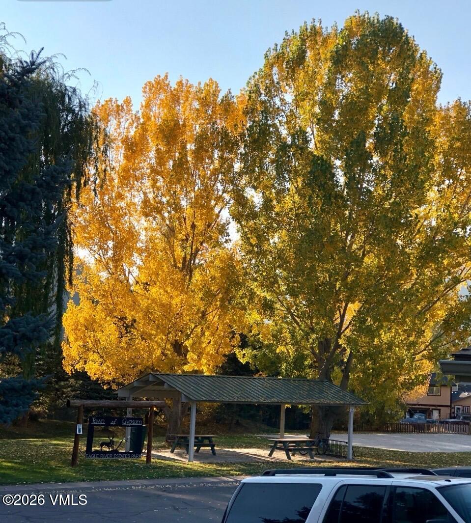 430 Porphyry Road Gypsum, CO 81637 - Photo 40 of 42 a backyard of a house with barbeque oven and outdoor seating