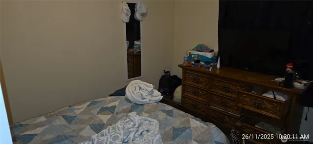 a room with a wooden table and a lamp