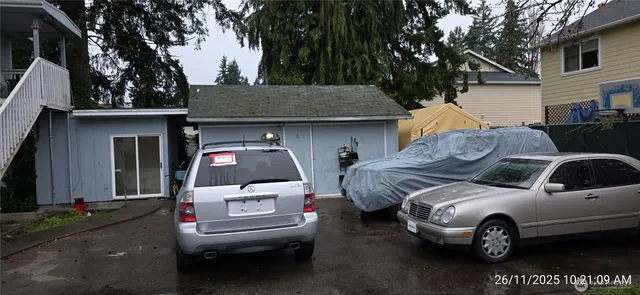 a front view of a house with parking space