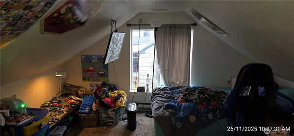 a room with lots of potted plants and a view of bedroom