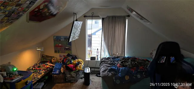 a room with lots of potted plants and a view of bedroom