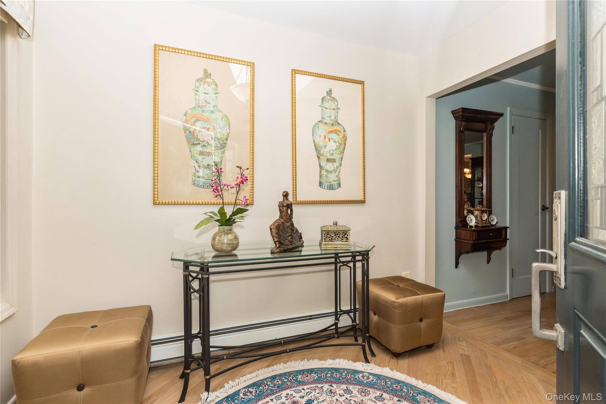 2772 Riverside Avenue Merrick, NY 11566 - Photo 10 of 45 a living room with furniture and paintings on the wall