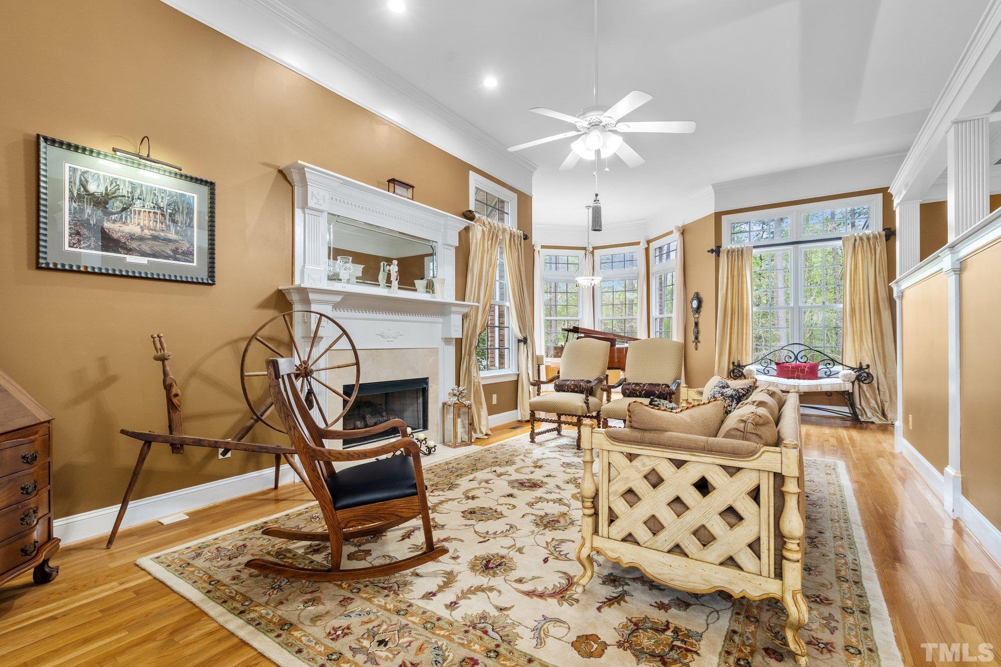 1145 Cash Road Creedmoor, NC 27522 - Photo 16 of 58 a living room with furniture a fireplace and a flat screen tv