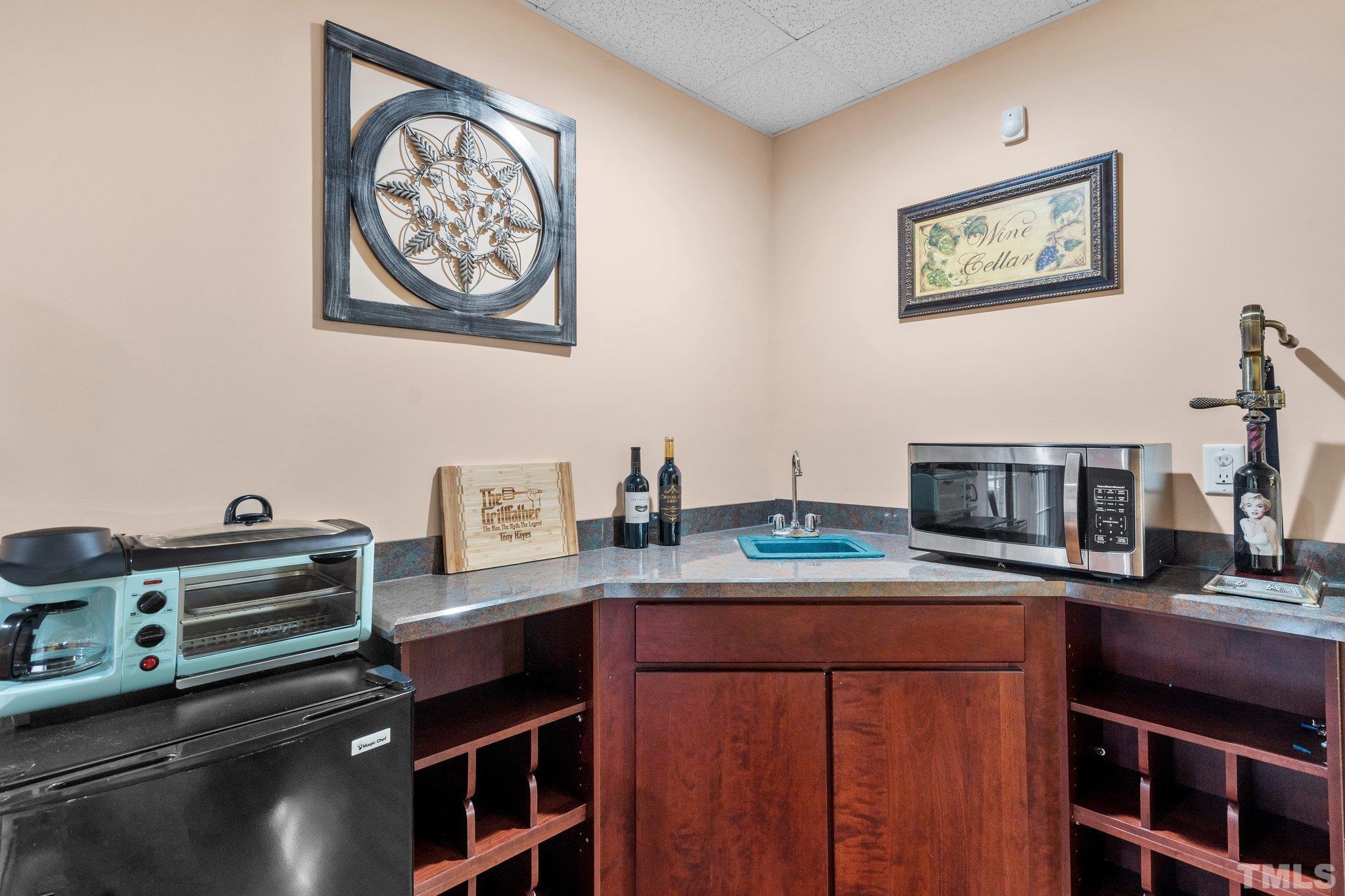 1145 Cash Road Creedmoor, NC 27522 - Photo 46 of 58 a kitchen with stainless steel appliances a stove and cabinets