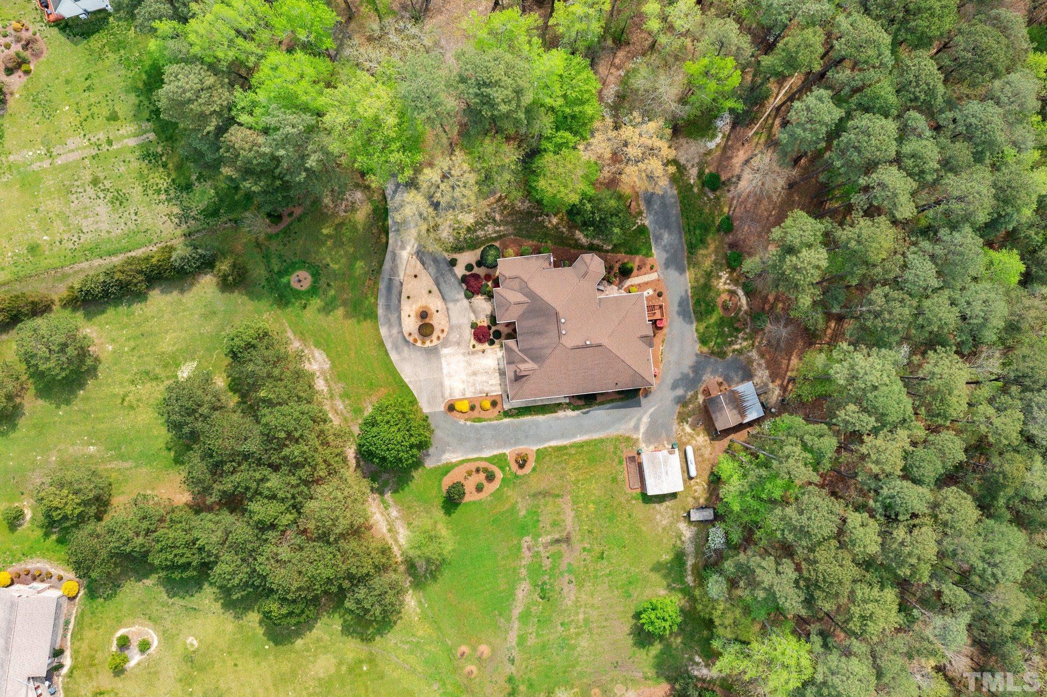 1145 Cash Road Creedmoor, NC 27522 - Photo 50 of 58 an aerial view of residential house with outdoor space and trees all around