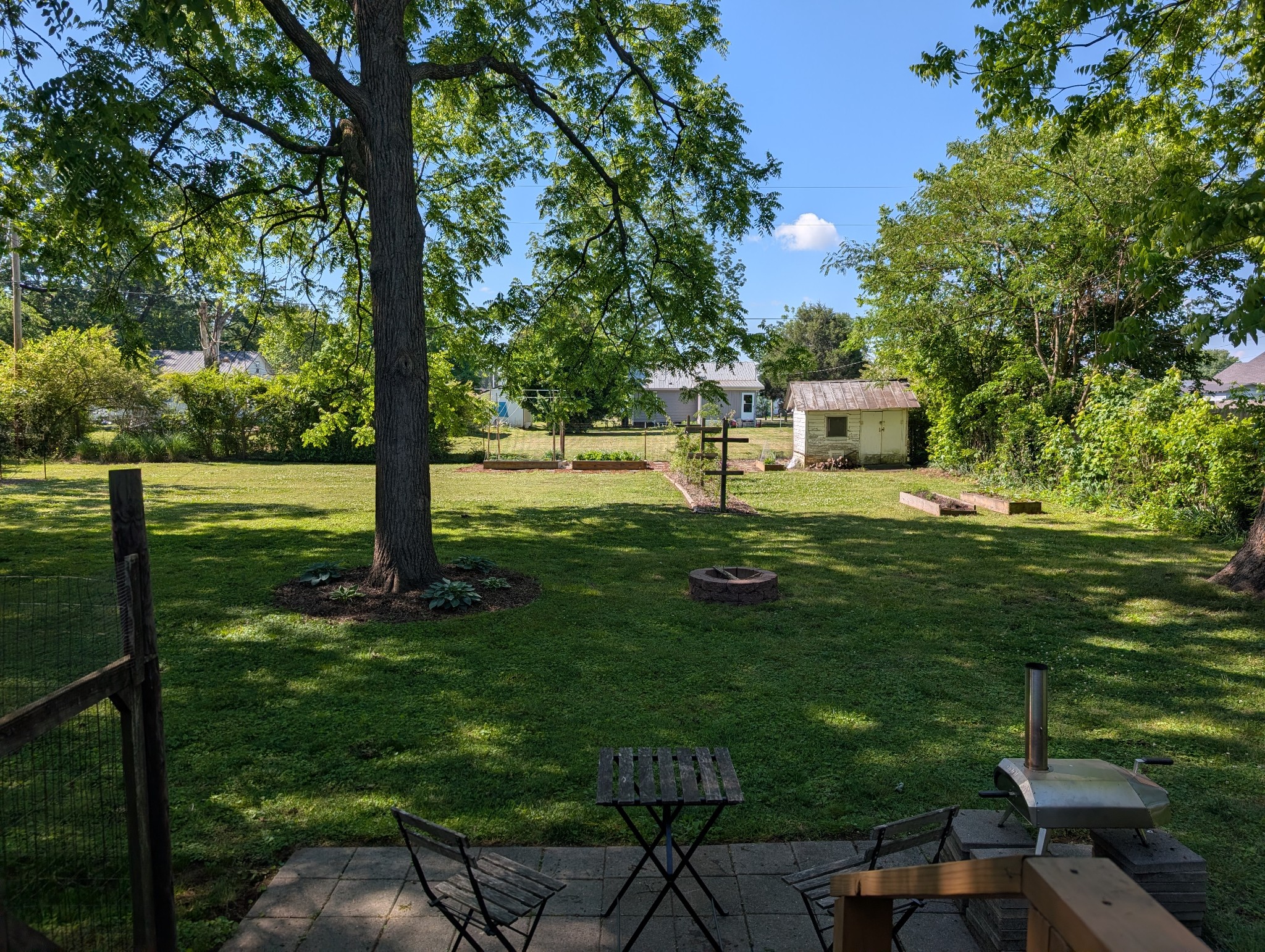 905 Nicholson Street Decherd, TN 37324 - Photo 27 of 27 a backyard of a house with table and chairs