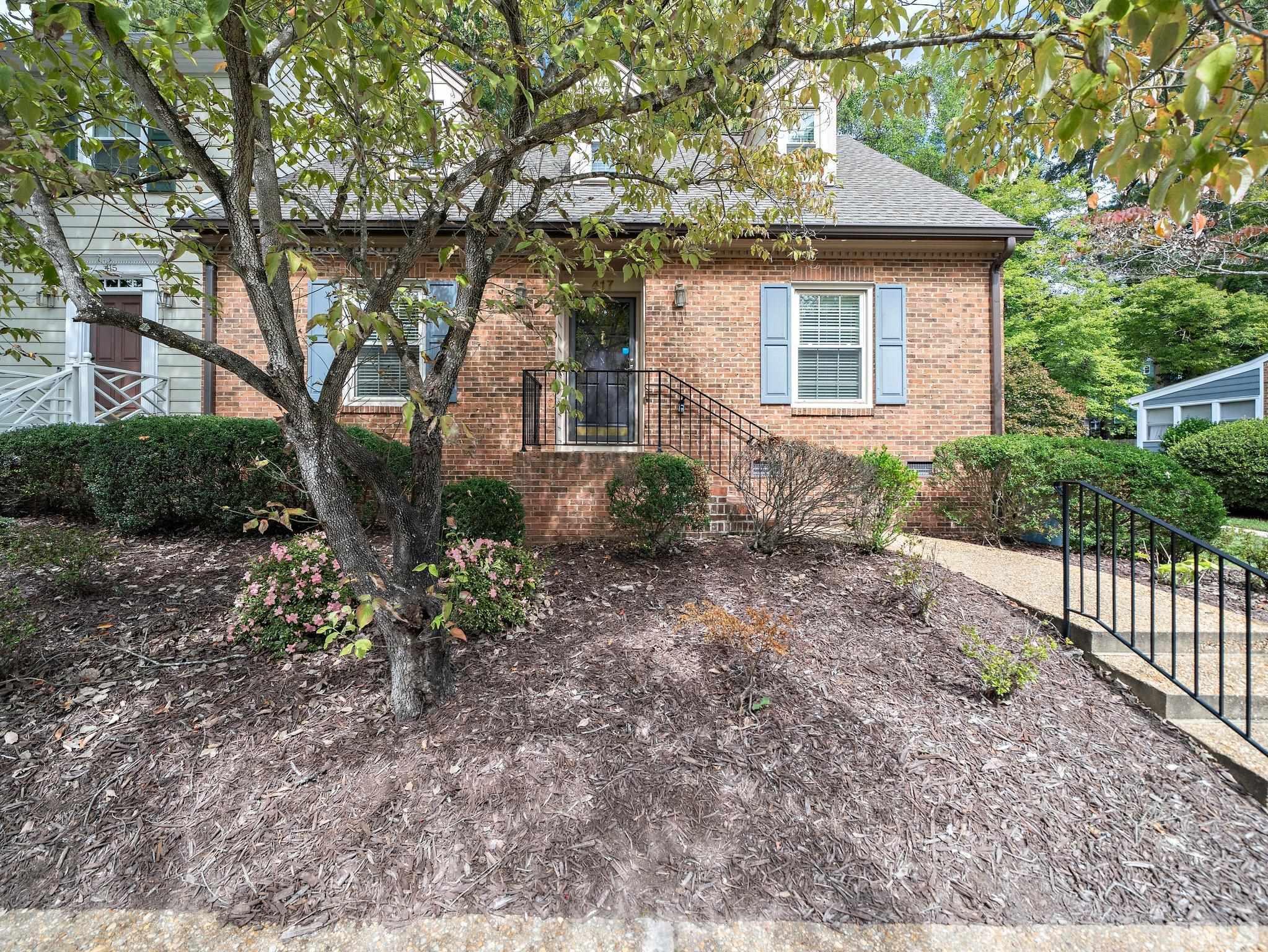 417 Weathergreen Drive Raleigh, NC 27615 - Photo 1 of 37 a front view of a house with garden