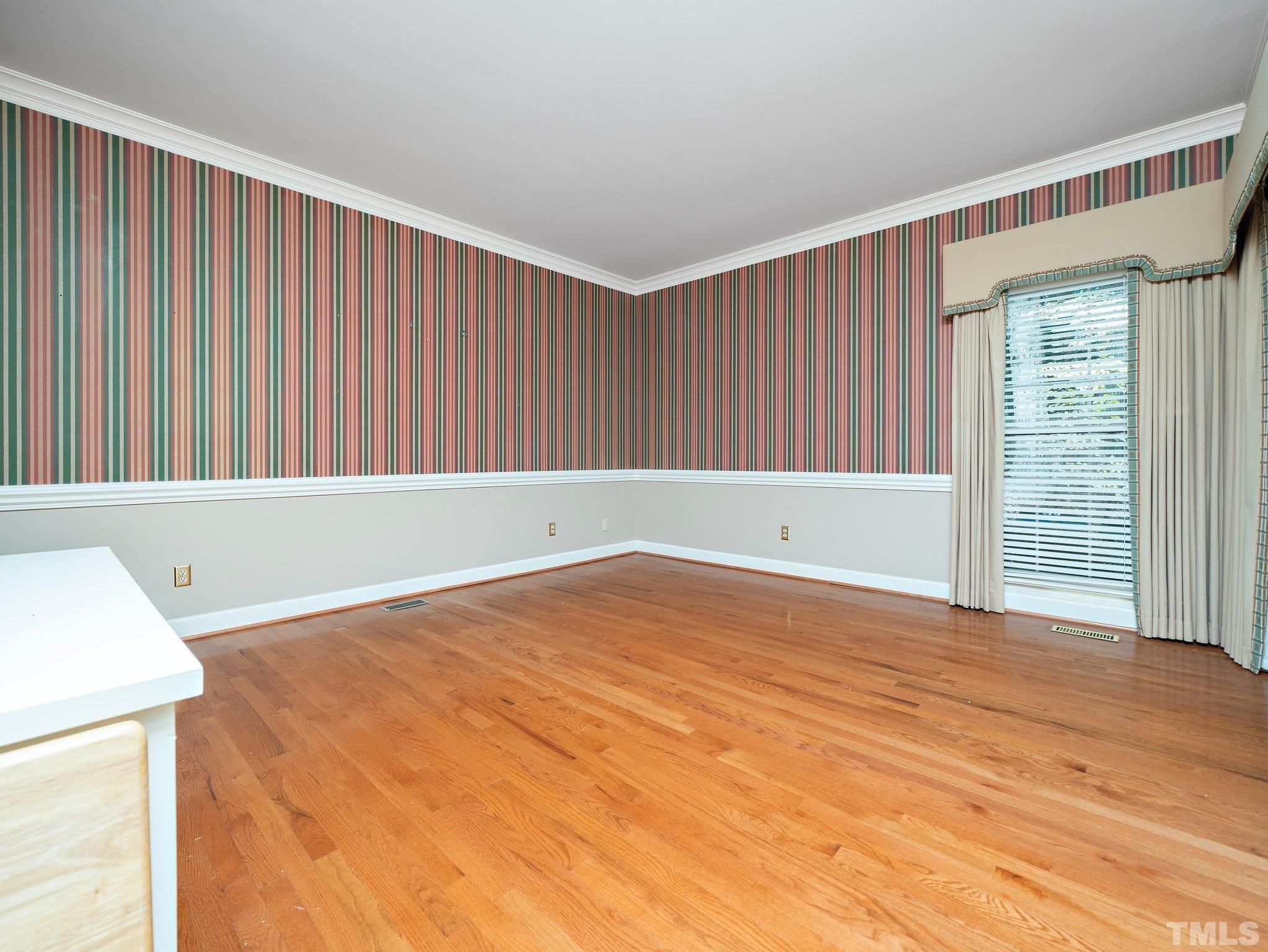 417 Weathergreen Drive Raleigh, NC 27615 - Photo 17 of 37 a view of an empty room with wooden floor