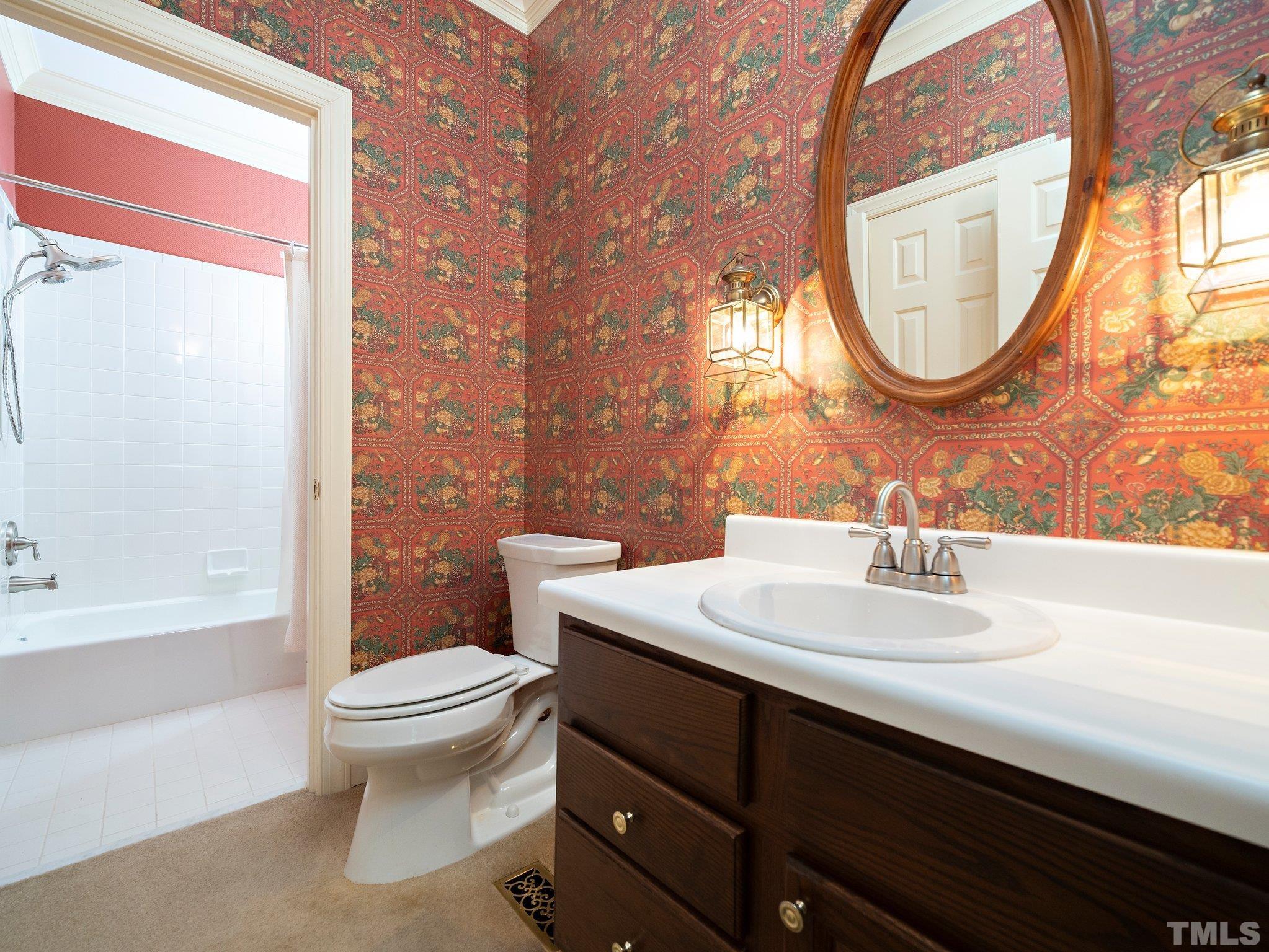 417 Weathergreen Drive Raleigh, NC 27615 - Photo 20 of 37 a bathroom with a sink a toilet and a mirror