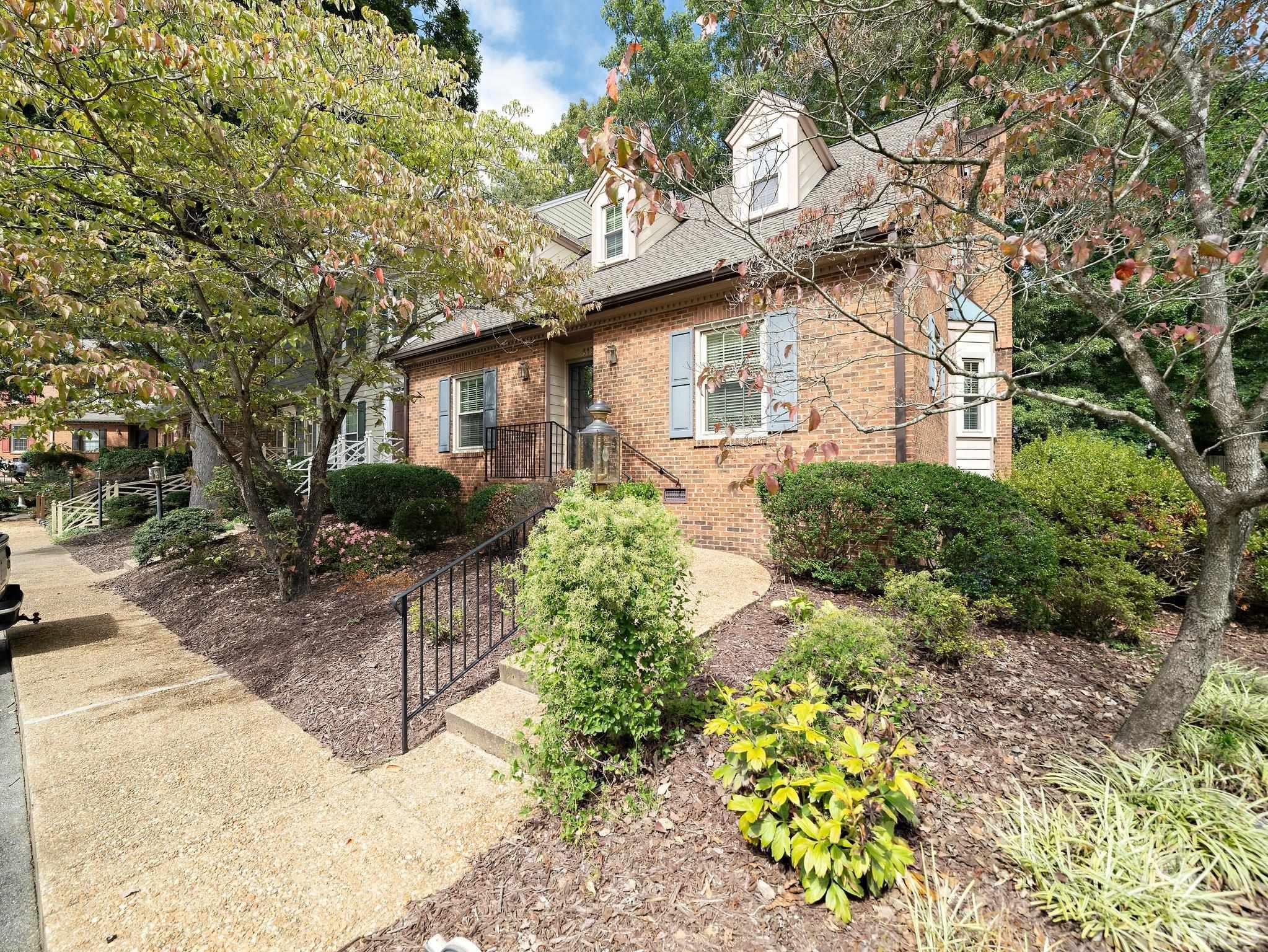 417 Weathergreen Drive Raleigh, NC 27615 - Photo 2 of 37 a front view of a house with a yard and potted plants