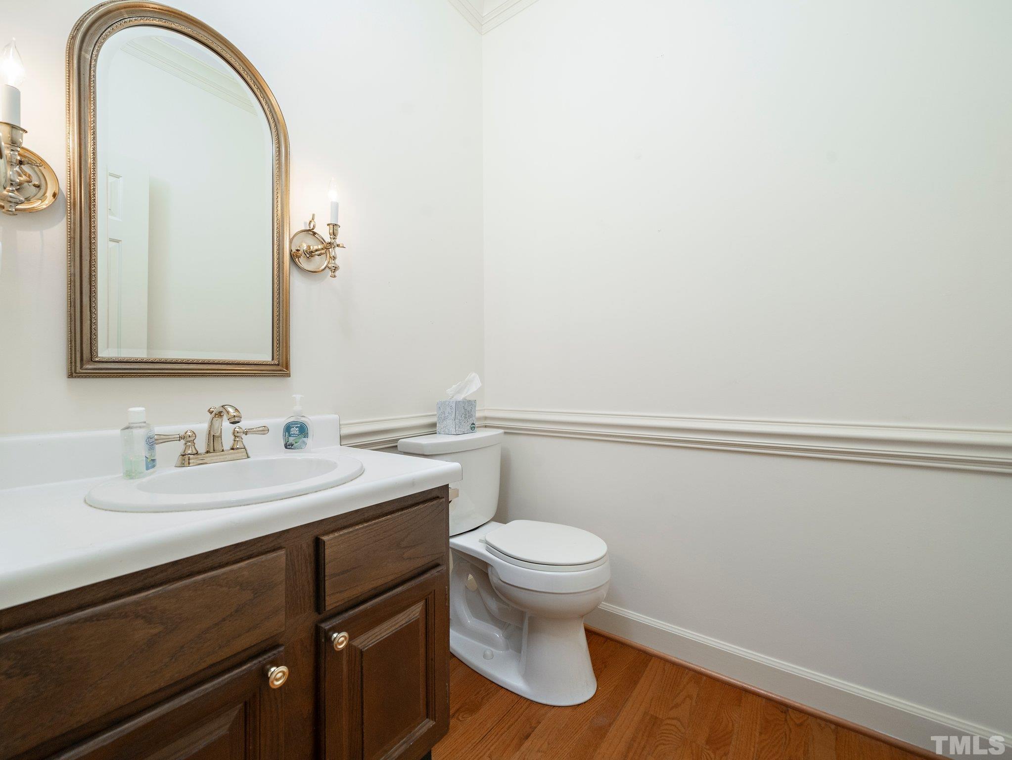 417 Weathergreen Drive Raleigh, NC 27615 - Photo 23 of 37 a bathroom with a toilet sink and mirror