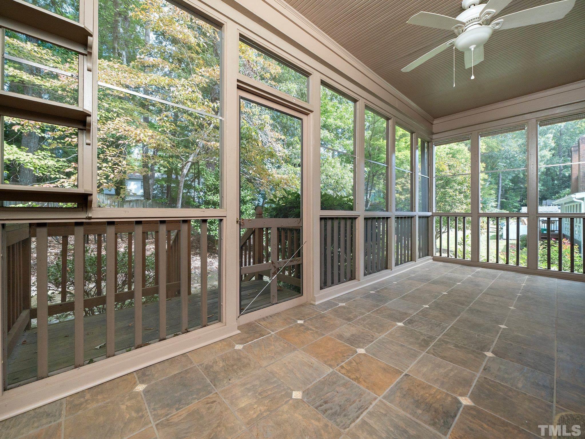 417 Weathergreen Drive Raleigh, NC 27615 - Photo 33 of 37 a view of a room with balcony and floor to ceiling windows